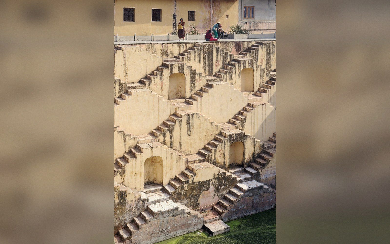 A stepwell's stacked stairs seen from the water line